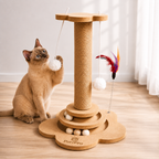 Kitten playing with a wooden cat toy with hanging balls and feathers on a mdf board floor.